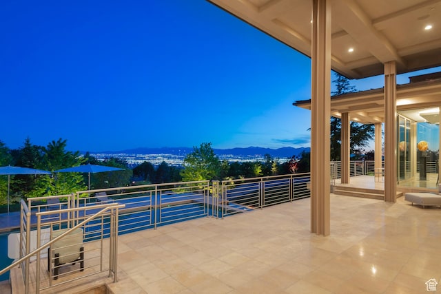 1559 E Tomahawk Dr N, Salt Lake City, UT 84103 - patio terrace at dusk with a mountain view and a balcony