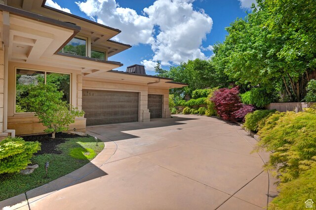 1559 E Tomahawk Dr N, Salt Lake City, UT 84103 - view of patio / terrace featuring a garage