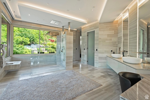 1559 E Tomahawk Dr N, Salt Lake City, UT 84103 - bathroom with tile walls, vanity, tile patterned flooring, and walk in shower