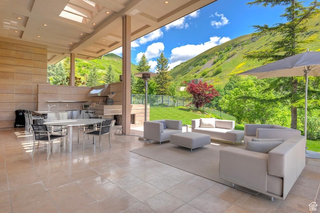 1559 E Tomahawk Dr N, Salt Lake City, UT 84103 - view of patio with a mountain view and an outdoor hangout area