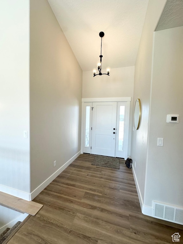 634 E Otto Ln, Grantsville, UT 84029 - foyer with a notable chandelier, visible vents, baseboards, and wood finished floors
