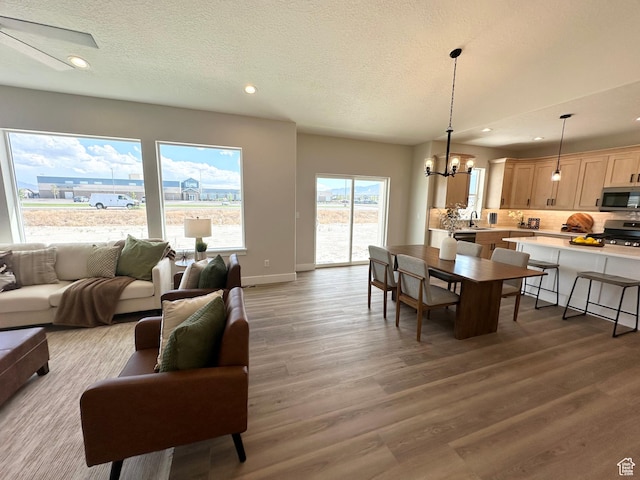 634 E Otto Ln, Grantsville, UT 84029 - interior space featuring a chandelier, recessed lighting, baseboards, and wood finished floors