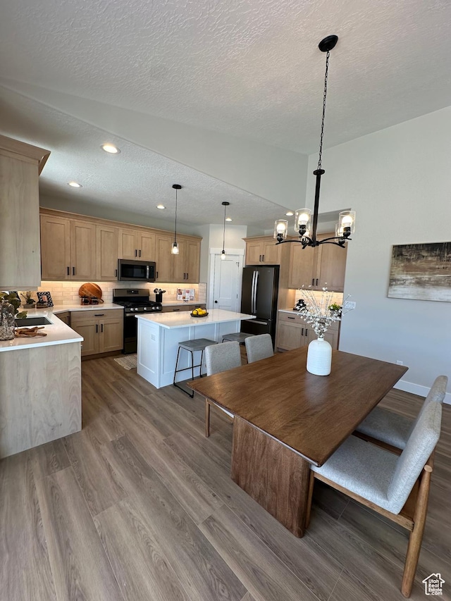 634 E Otto Ln, Grantsville, UT 84029 - dining room featuring recessed lighting, a textured ceiling, an inviting chandelier, and dark wood-style floors