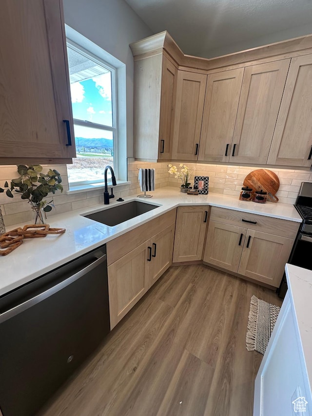 634 E Otto Ln, Grantsville, UT 84029 - kitchen featuring light brown cabinetry, a sink, light countertops, dishwasher, and light wood-type flooring