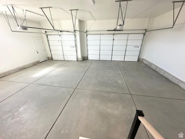 634 E Otto Ln, Grantsville, UT 84029 - garage with a garage door opener and baseboards