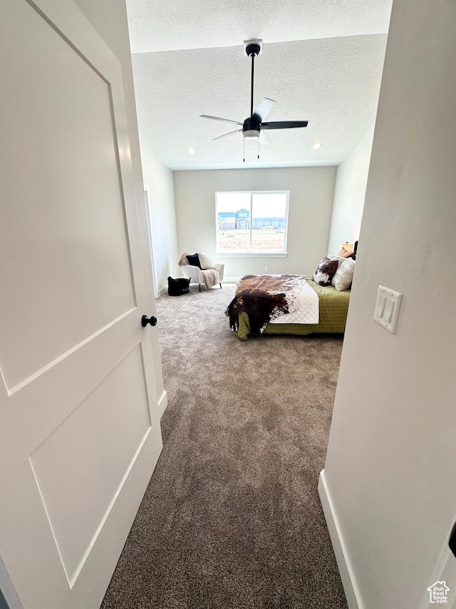 634 E Otto Ln, Grantsville, UT 84029 - carpeted bedroom featuring a textured ceiling and a ceiling fan