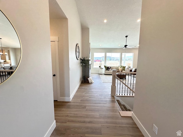 634 E Otto Ln, Grantsville, UT 84029 - corridor featuring baseboards, an upstairs landing, recessed lighting, wood finished floors, and a textured ceiling