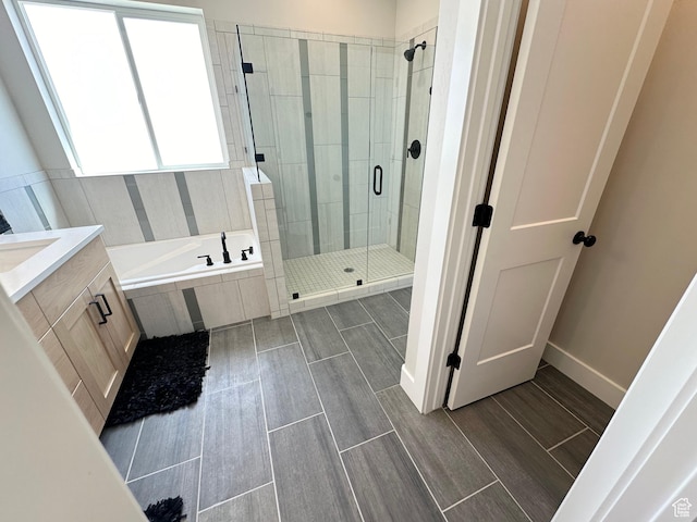 634 E Otto Ln, Grantsville, UT 84029 - bathroom featuring a garden tub, vanity, wood tiled floor, and a shower stall