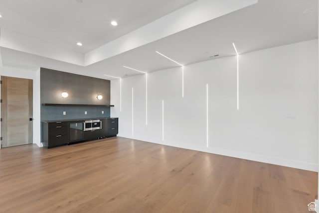 7702 N Fire Ring Glade, Park City, UT 84098 - unfurnished living room featuring light hardwood / wood-style flooring