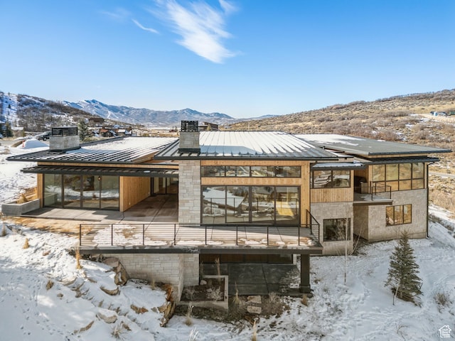 7702 N Fire Ring Glade, Park City, UT 84098 - snow covered rear of property featuring a mountain view