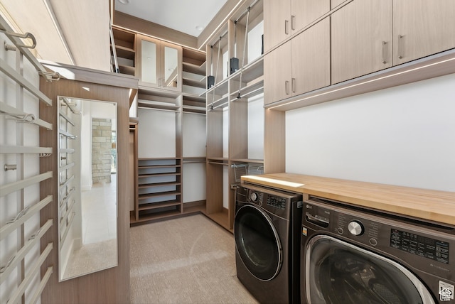 7702 N Fire Ring Glade, Park City, UT 84098 - laundry room with cabinets, washing machine and dryer, and light carpet