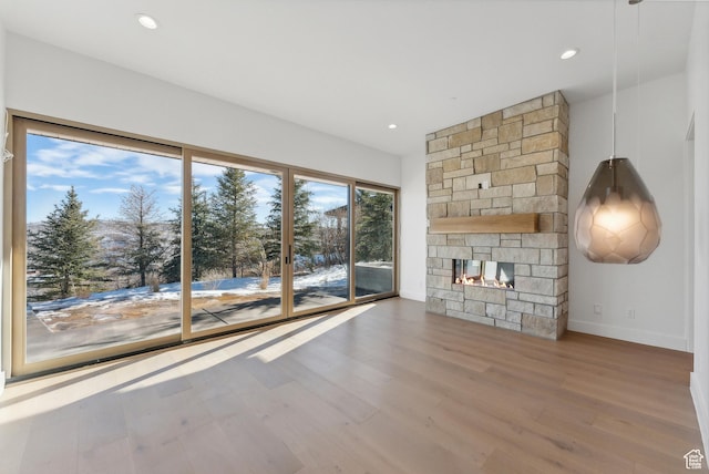 7702 N Fire Ring Glade, Park City, UT 84098 - unfurnished living room featuring a fireplace and hardwood / wood-style flooring