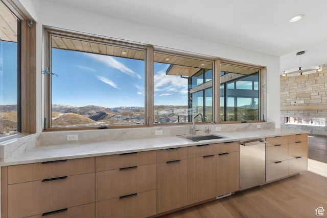 7702 N Fire Ring Glade, Park City, UT 84098 - kitchen featuring a mountain view, sink, a healthy amount of sunlight, and decorative light fixtures