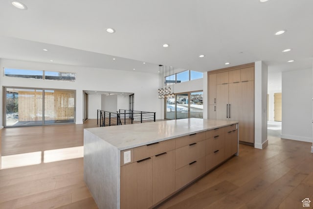 7702 N Fire Ring Glade, Park City, UT 84098 - kitchen with light brown cabinetry, light wood-type flooring, and plenty of natural light