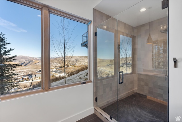 7702 N Fire Ring Glade, Park City, UT 84098 - bathroom with tile patterned floors, a mountain view, plenty of natural light, and an enclosed shower
