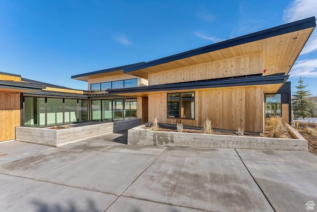 7702 N Fire Ring Glade, Park City, UT 84098 - back of house with a patio area