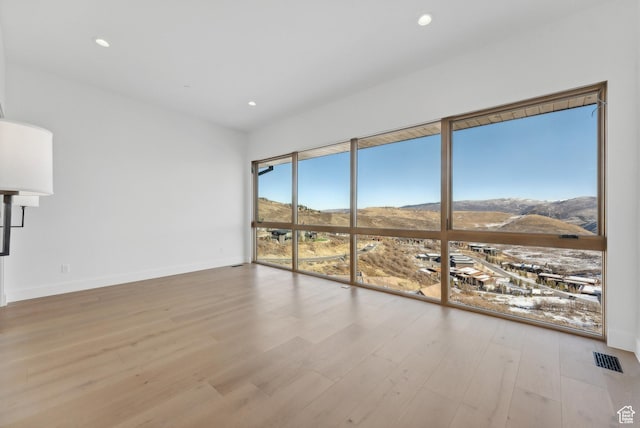 7702 N Fire Ring Glade, Park City, UT 84098 - unfurnished room featuring a mountain view and light wood-type flooring