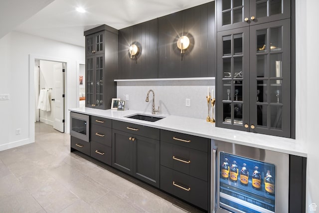 2984 N 1080 W, Lehi, UT 84043 - bar with stainless steel microwave, wine cooler, baseboards, backsplash, and a sink