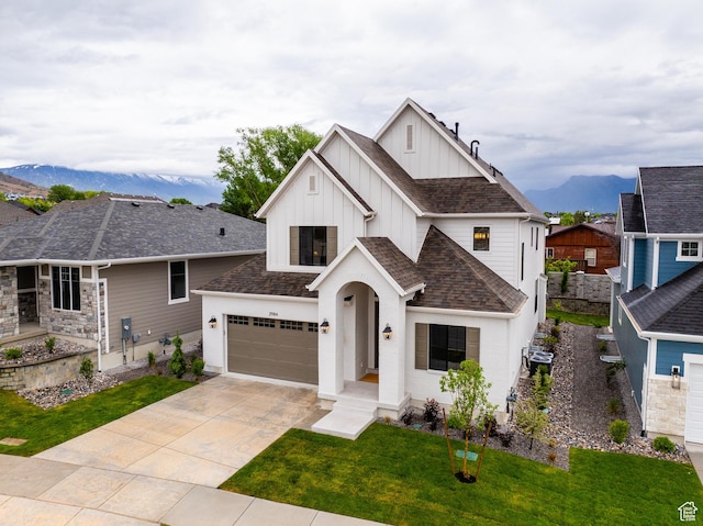 2984 N 1080 W, Lehi, UT 84043 - view of front facade featuring driveway, a front yard, roof with shingles, board and batten siding, and a mountain view
