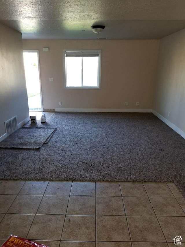 818 S 50 E, Vernal, UT 84078 - tiled empty room featuring a textured ceiling