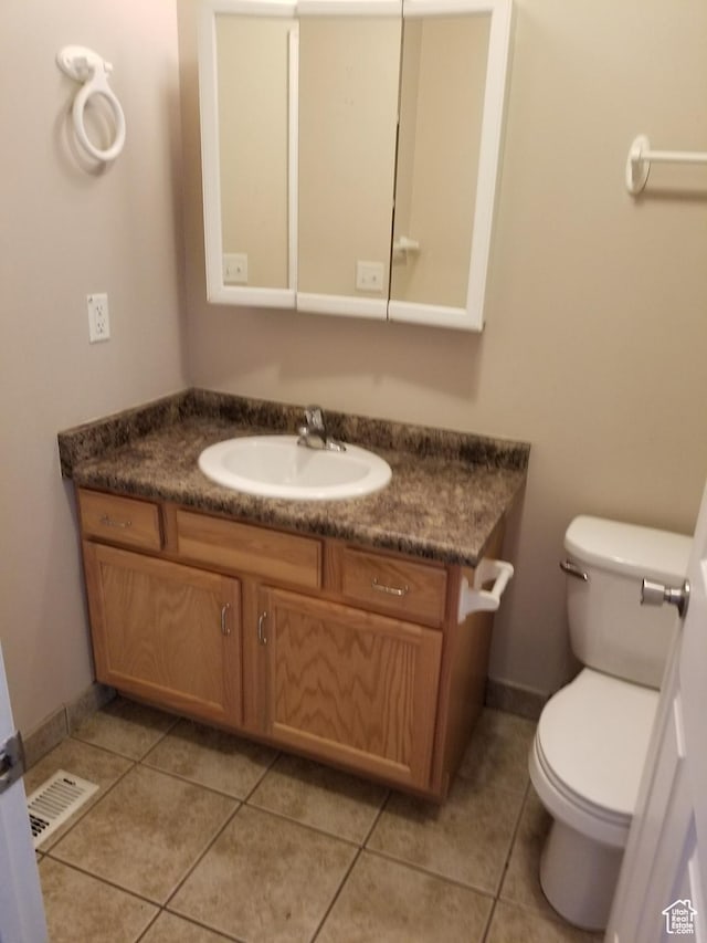 818 S 50 E, Vernal, UT 84078 - bathroom with tile patterned floors, vanity, and toilet