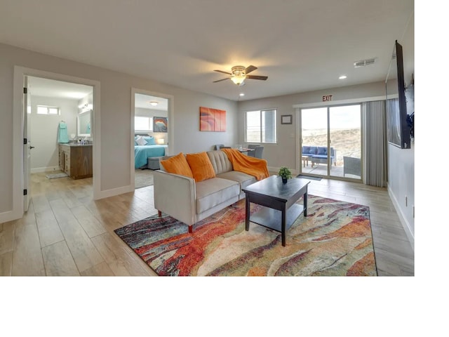 living room featuring recessed lighting, baseboards, visible vents, and light wood finished floors