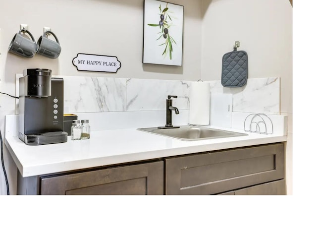 bathroom with decorative backsplash and vanity