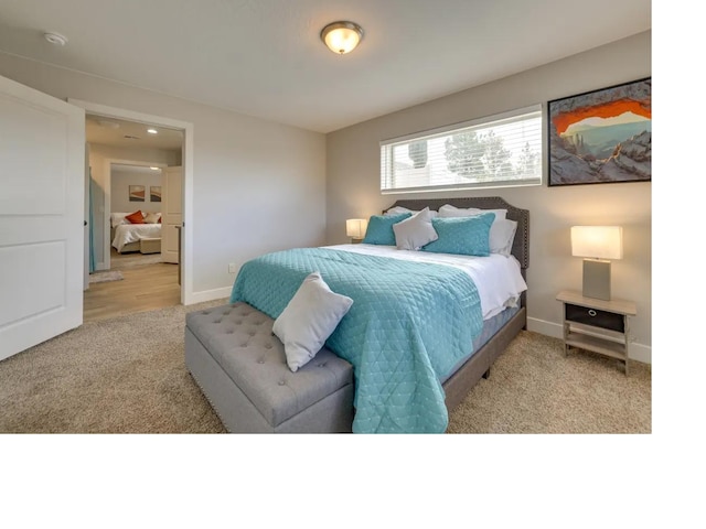 bedroom featuring carpet floors and baseboards