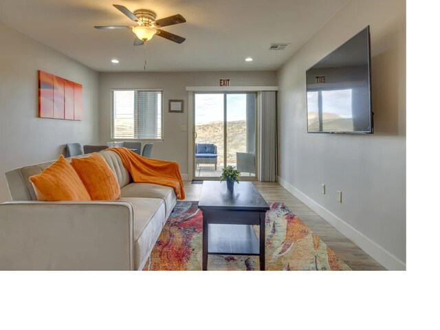 living room featuring recessed lighting, visible vents, a ceiling fan, wood finished floors, and baseboards