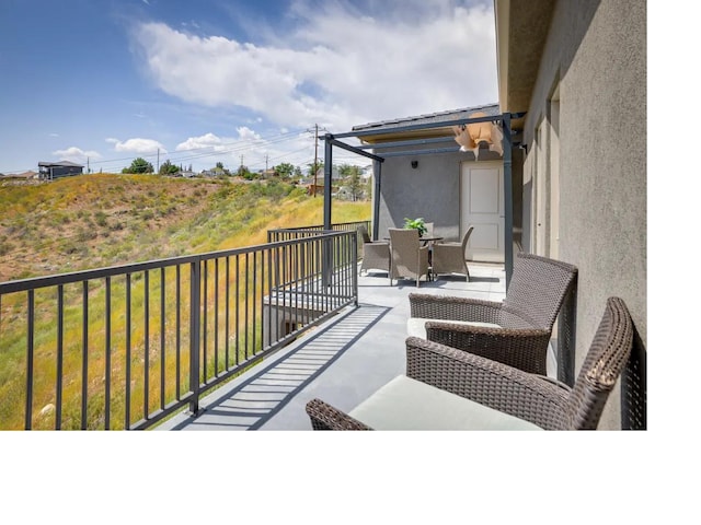 balcony with outdoor dining area