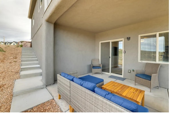 view of patio / terrace featuring stairs and outdoor lounge area