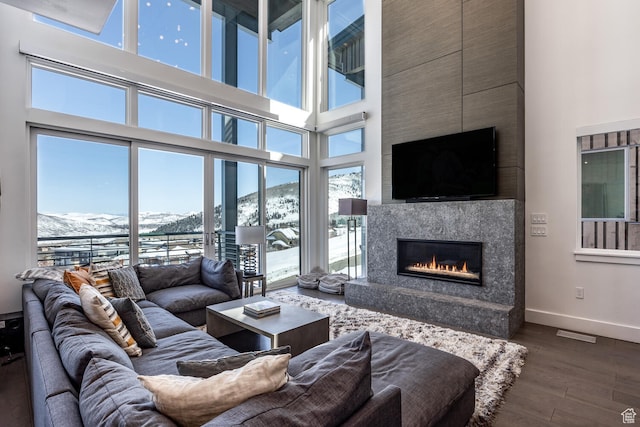 2752 W High Rd Unit 1501, Park City, UT 84098 - living room with a towering ceiling, dark hardwood / wood-style flooring, a mountain view, and a high end fireplace