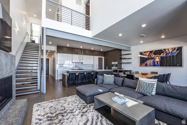 2752 W High Rd Unit 1501, Park City, UT 84098 - living room featuring a high ceiling, sink, and dark hardwood / wood-style flooring