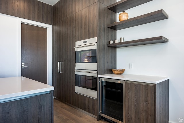 2752 W High Rd Unit 1501, Park City, UT 84098 - kitchen with beverage cooler, dark brown cabinets, dark hardwood / wood-style flooring, and double oven