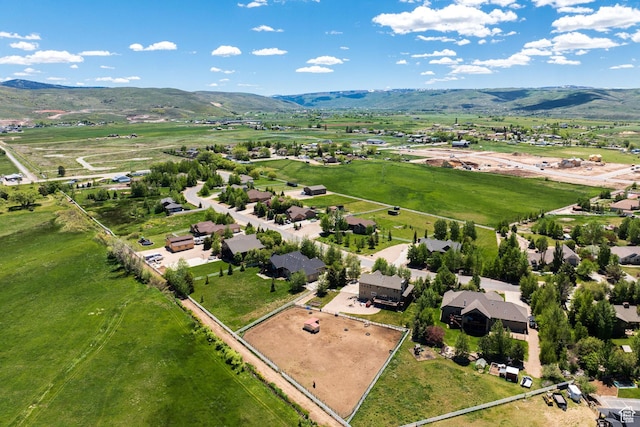bird's eye view featuring a rural view and a mountain view