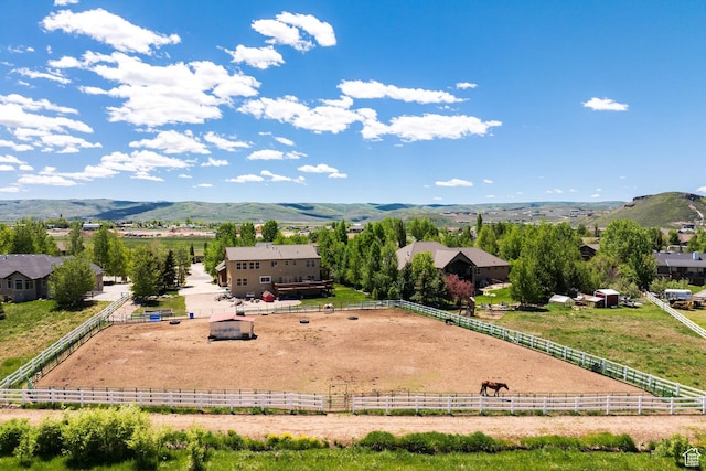drone / aerial view with a mountain view and a rural view