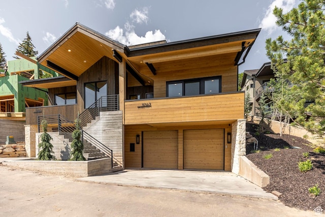 1063 Lowell Ave Unit 1, Park City, UT 84060 - contemporary house featuring an attached garage, stairway, and driveway