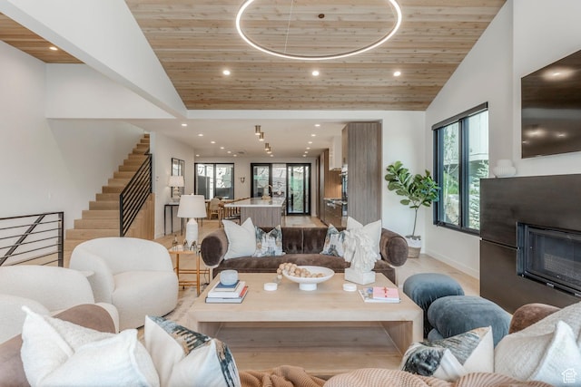1063 Lowell Ave Unit 1, Park City, UT 84060 - living area with vaulted ceiling, wooden ceiling, stairs, recessed lighting, and a fireplace
