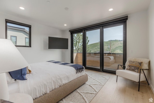 1063 Lowell Ave Unit 1, Park City, UT 84060 - bedroom with access to outside, wood finished floors, and recessed lighting