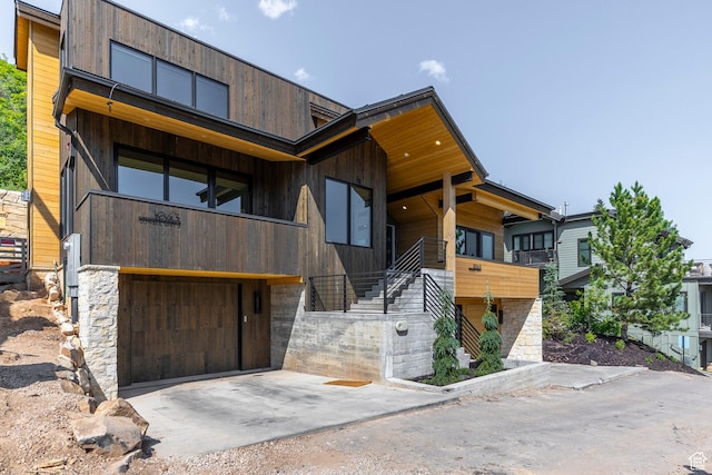 1063 Lowell Ave Unit 1, Park City, UT 84060 - contemporary house featuring a garage, stairway, and concrete driveway