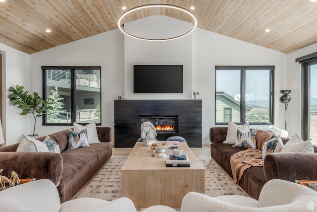 1063 Lowell Ave Unit 1, Park City, UT 84060 - living area featuring vaulted ceiling, wood ceiling, recessed lighting, a glass covered fireplace, and wood finished floors