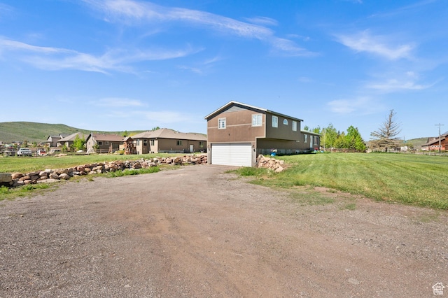 1635 W 200 S, Kamas, UT 84036 - view of side of home featuring a mountain view, a yard, and a garage