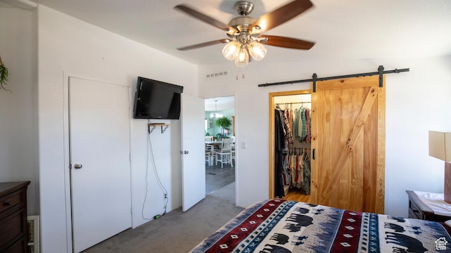 33432 W 8000 S, Duchesne, UT 84021 - bedroom featuring carpet floors, a barn door, a closet, and a ceiling fan