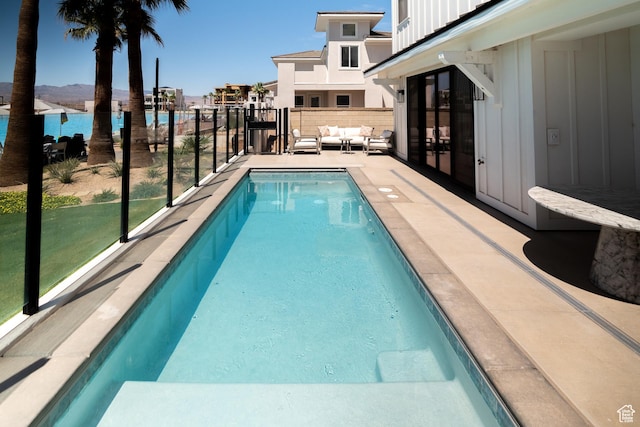 5420 S Persian Ln, St George, UT 84790 - view of swimming pool featuring a water view and an outdoor hangout area