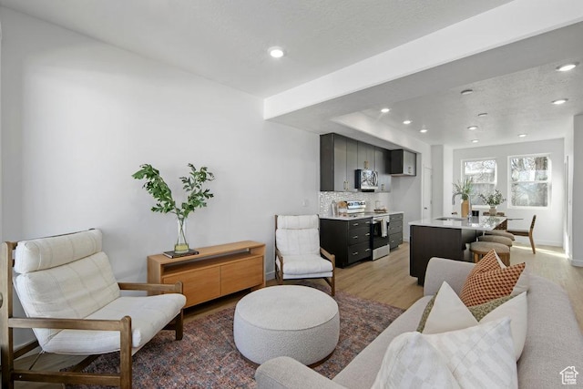 439 N 268 W Unit 4-18, Salt Lake City, UT 84103 - living area featuring light wood-type flooring, recessed lighting, and baseboards