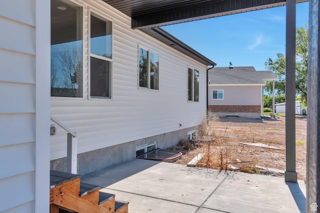 1118 E 1310 S, Garland, UT 84312 - view of property exterior with a patio and crawl space