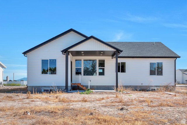 1118 E 1310 S, Garland, UT 84312 - rear view of property with entry steps and a shingled roof