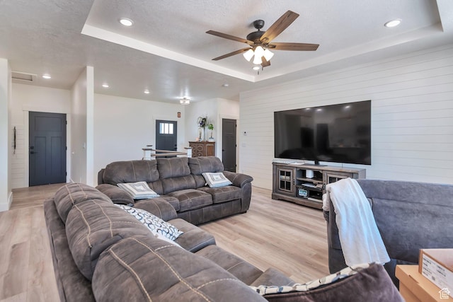 1118 E 1310 S, Garland, UT 84312 - living area featuring a tray ceiling, ceiling fan, recessed lighting, and light wood-style flooring