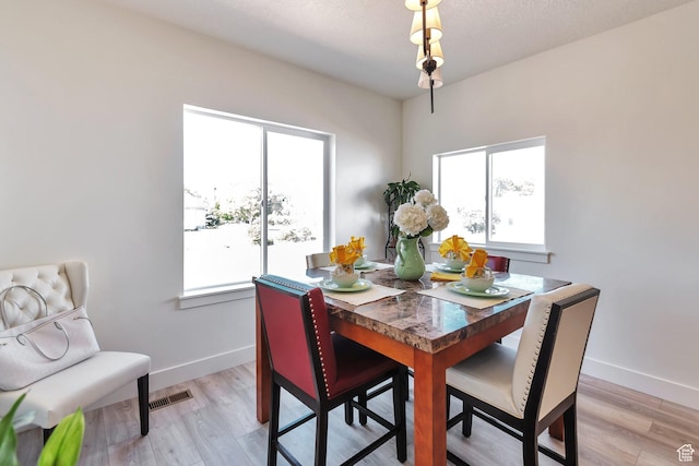 1118 E 1310 S, Garland, UT 84312 - dining space with visible vents, light wood-type flooring, and plenty of natural light