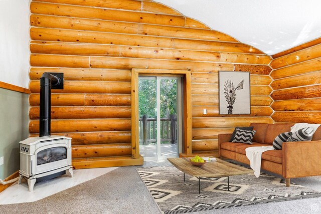 3383 Wild Mare Way, Heber City, UT 84032 - carpeted living area with a wood stove, rustic walls, baseboards, and vaulted ceiling
